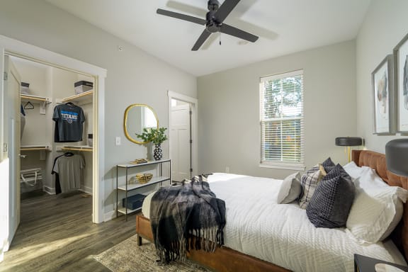 a bedroom with a large bed and a ceiling fan  at Oakbrook Townhomes, Tennessee, 37067