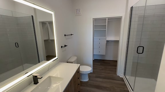 A white sink with a mirror above it.