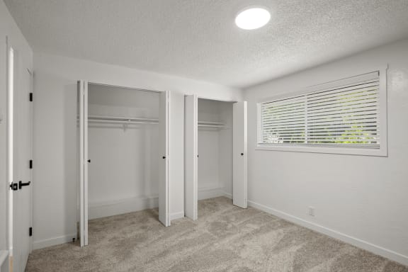 a bedroom with a large window and a closet at Chalet, Oregon