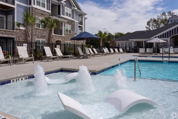 take a dip in our resort style pool at The Retreat at Fuquay-Varina Apartments, Fuquay-Varina, North Carolina