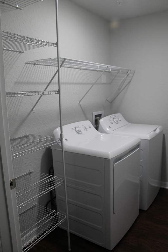 A laundry room with a washer and dryer.
