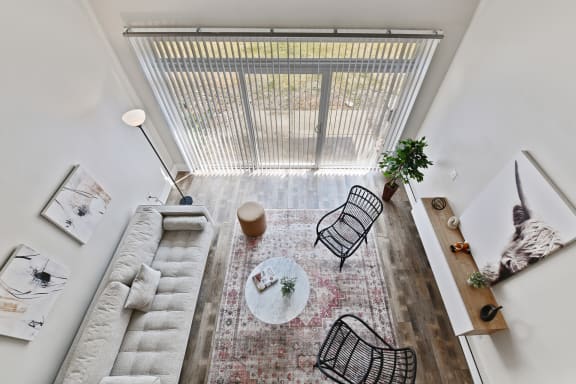 Overhead view of living area with vertical blinds at Fox Run Apartments, Illinois, 60174