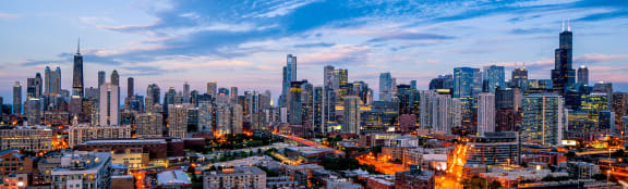 a view of the city at dusk