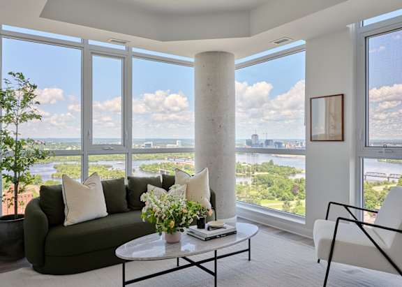 A living room with a view of the city.