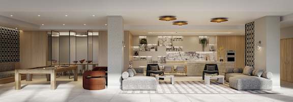 A modern living room with a kitchen in the background.