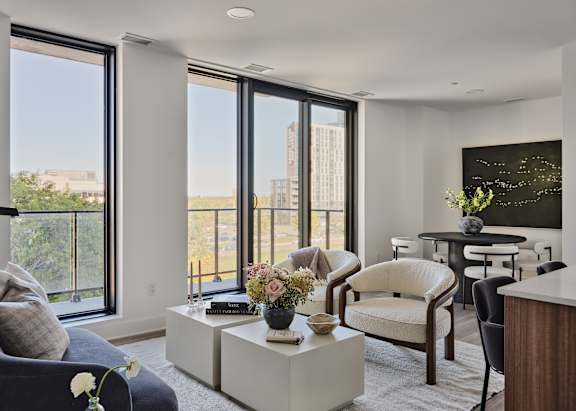 A living room with a view of the city.