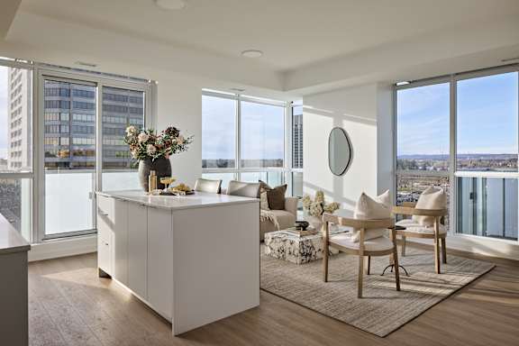 A modern kitchen with a view of the city.