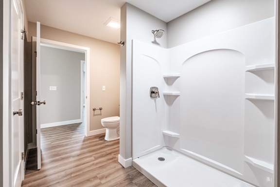 Spacious bathroom with walk in shower and fixtures at Windham Village Apartments, Maine