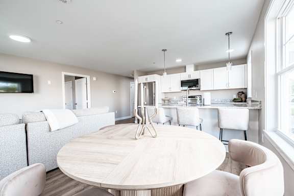 Open concept living and kitchen with island seating at Windham Village Apartments, Windham, ME 04062