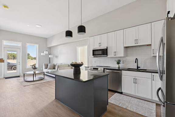 A modern kitchen with a large island in the center.