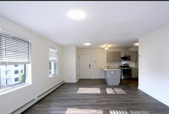 Open-Concept Layout with Seamless Flow from Living Room to Kitchen