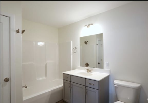 Bright and Functional Bathroom Awaiting Your Creative Touch