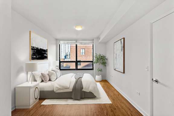 Wooden floor bedroom at Chateau on Wells, Chicago, Illinois