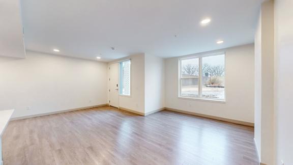 A room with a window and a door.