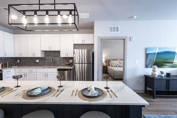 A modern kitchen with a large island in the middle.