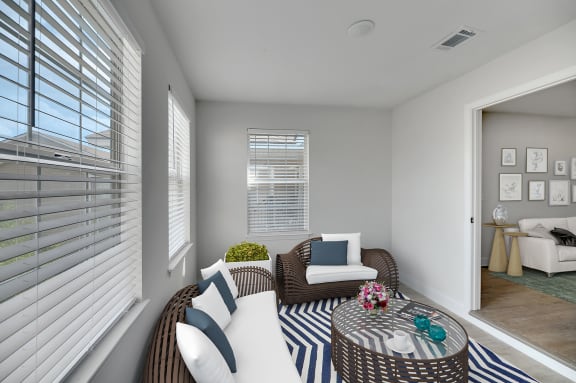 a living room with two couches and a round table