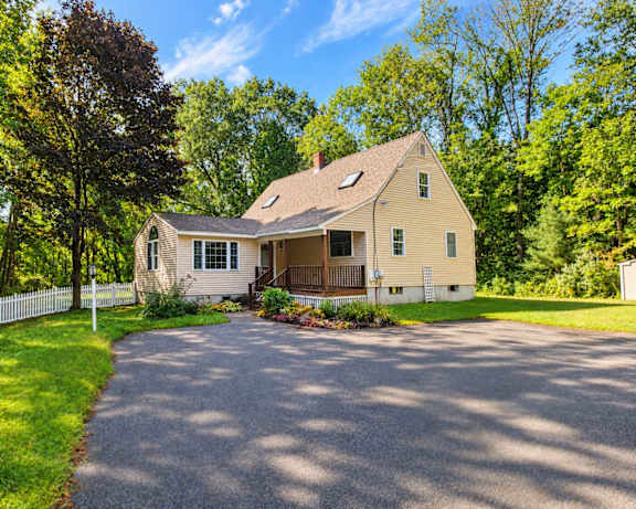 A house with a driveway in front of it.