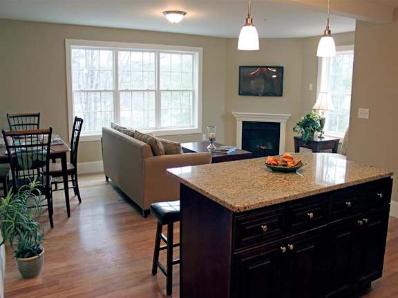 A kitchen with a counter and a couch.