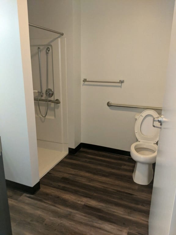 a small bathroom with a toilet and a shower