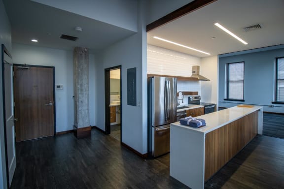 a kitchen with a counter top and a refrigerator