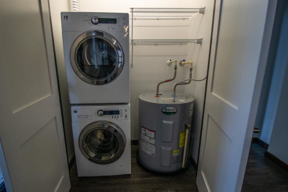 a washing machine and a dryer in a laundry room