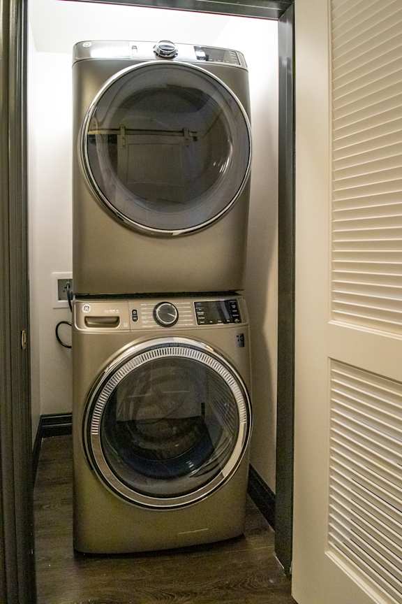 A washing machine is in a small room.