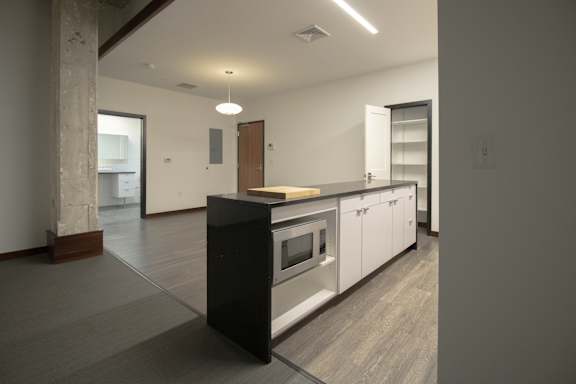 a kitchen with an island and a stove in a house