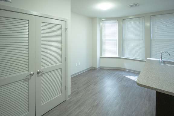 A room with a sink and a window.