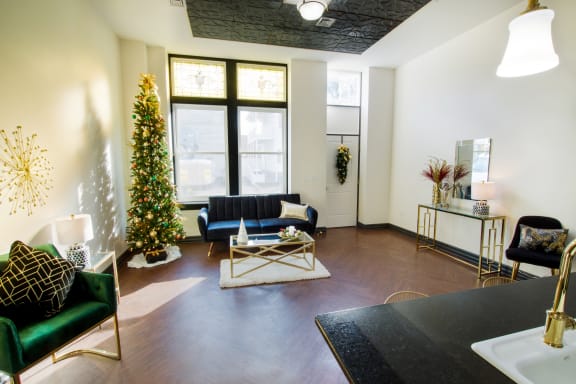 a living room with a christmas tree and a couch