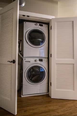 a washing machine and a dryer in a closet