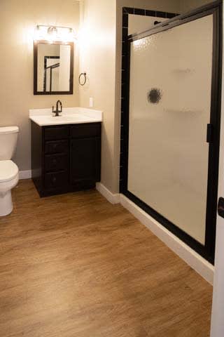 a bathroom with a toilet sink and a shower