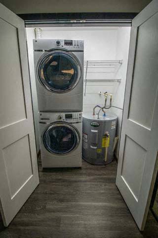 a washer and a dryer in a small laundry room