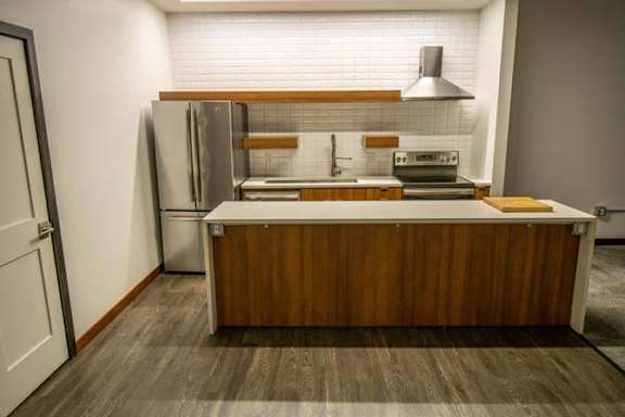 a kitchen with a stove and a refrigerator