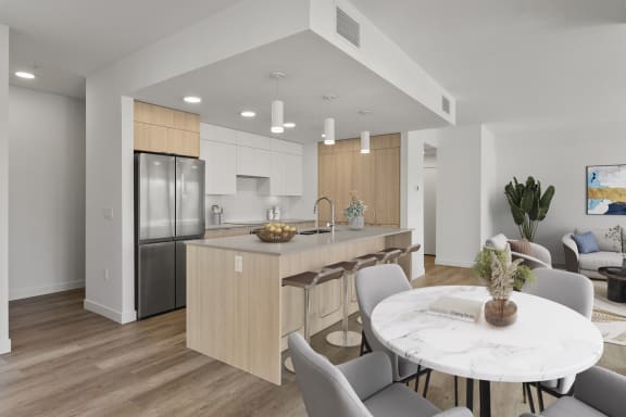 a kitchen and dining area in a 555 waverly unit