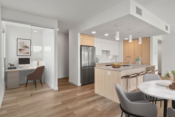 a kitchen and dining area in a 555 waverly unit