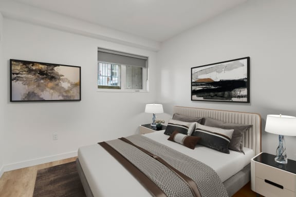 a bedroom with a bea2 bedroom townhouse in kelownad and two night stands