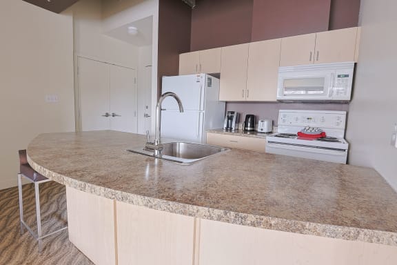 a kitchen with a counter top and a sink