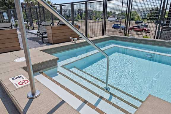 A pool with a no swimming sign on the floor.