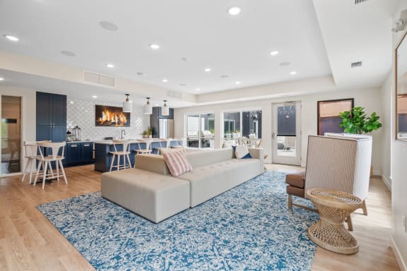 a living room with a couch and a rug
