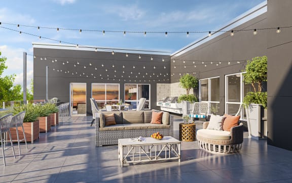 a roof deck with couches chairs and a coffee table