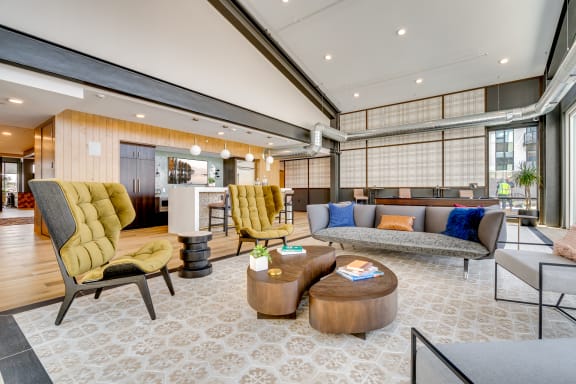 a living room filled with furniture and a large window
