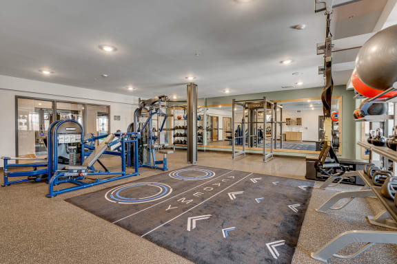 the gym at the enclave at woodbridge apartments in sugar land, tx