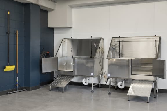 a commercial kitchen with stainless steel units and stainless steel benches