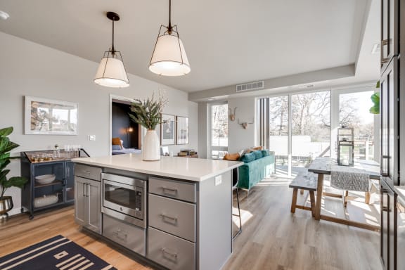 a view of the kitchen and living room from the dining area
