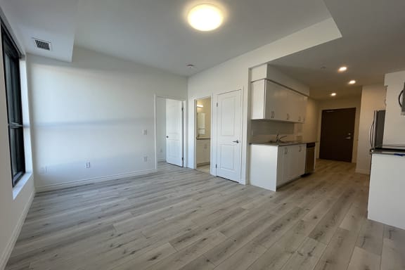 Bayfield Tower 1 bedroom 1 bathroom variation A living room with kitchen seen in the background