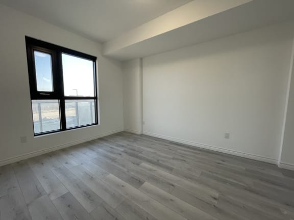Bayfield Tower Apartments 1 bedroom 1 bathroom variation D bedroom with a large window
