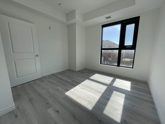 Bayfield Tower Apartments 1 bedroom 1 bathroom variation E bedroom with large window