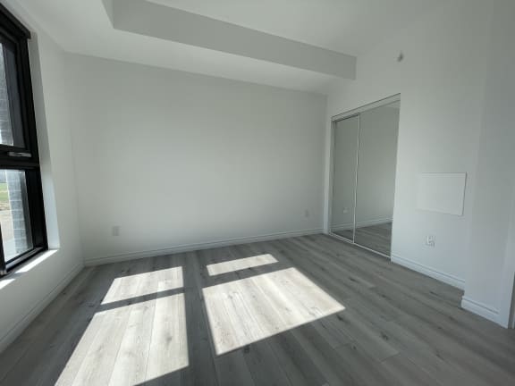 Bayfield Tower Apartments 1 bedroom 1 bathroom variation E bedroom with sliding mirror door closet