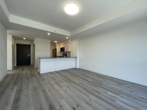 Bayfield Tower Apartments 1 bedroom 1 bathroom variation E open-concept living area looking toward kitchen