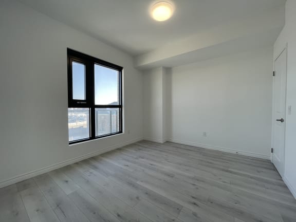 Bayfield Tower Apartments 2 bedroom 1 bathroom variation A second bedroom with a large window